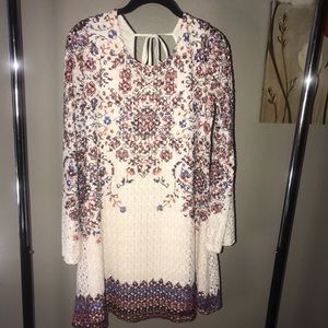 Floral long sleeve dress with a tie back.